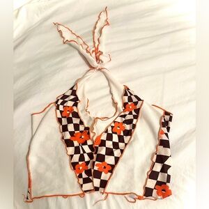 Halter flower checkerboard top. Orange, brown, and white. Size medium